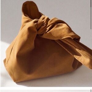 MERIT Tan Knot Bag - for makeup or everyday use.